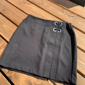 Black mini skirt with grommet detail